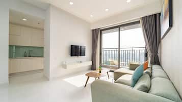 Apartment, 3 Bedrooms, City View | Living area | 49-inch Smart TV with cable channels, pay films