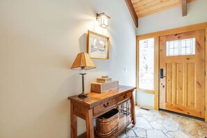 A wooden desk with a lamp, a framed picture, and boxes on it. - 4 Virginia Rail - Dog-Friendly Sunriver Home with A/C, Hot Tub & SHARC Passes (Sunriver)