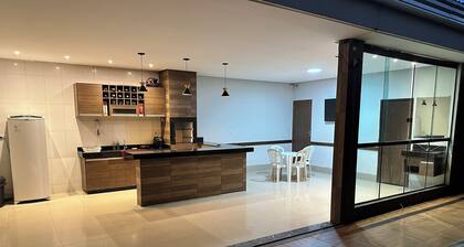 Guesthouse with pool and gourmet area, great location.
