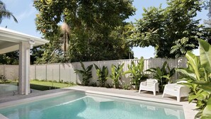 A rectangular swimming pool with a white fence and plants around it. - Mooloolaba Family 5 Bedroom Haven (Sunshine Coast)