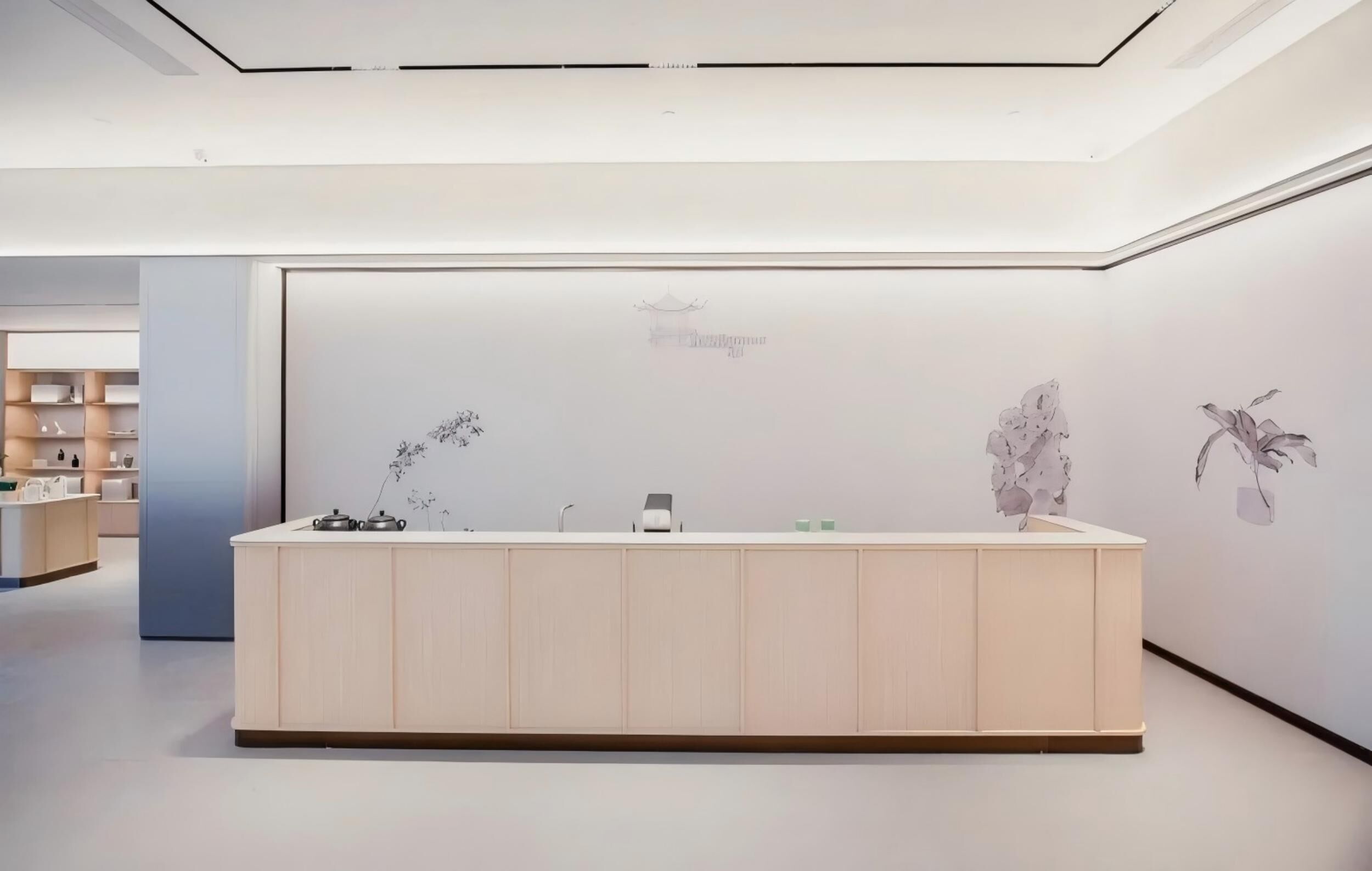 Un mostrador de recepción de diseño minimalista, con un panel informativo en la pared y un interior moderno y limpio.