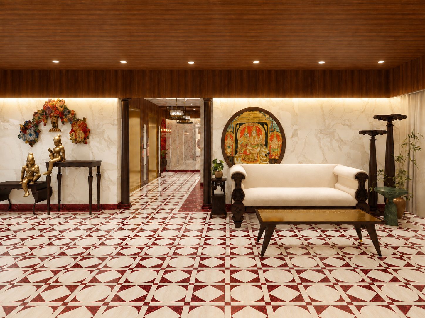 A lobby with a patterned floor, a sofa, a table, and decorative statues.
