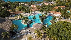 A resort with a large central pool, multiple smaller pools, and a beach area with sun loungers. - VIP Villa at All-Inclusive Resort 3B (Confresi Beach)