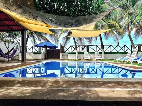 Peaceful 4-bedroom beach house with AC and private pool