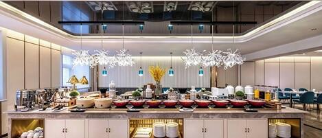 A modern hotel lobby with a central reception desk, a seating area, and a decorative ceiling.