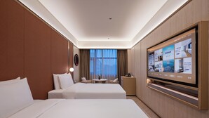 A hotel room with two beds, a TV, and a view of the city. - Crystal Hotel Zhongguancun Renmin Univ. (Beijing)
