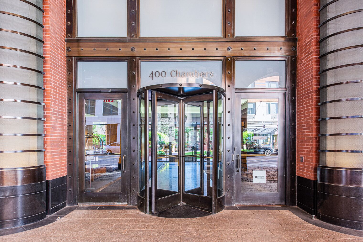 A revolving door entrance with the number 400 and the name 'Chambers' above it.