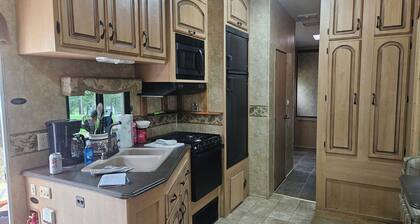 Camper 6 Enjoyable 2-bedroom recreational vehicle with AC just out of Fair Play.