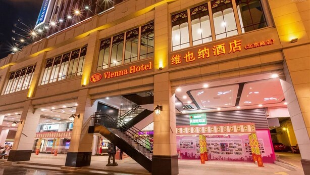 Vienna Hotel with a prominent entrance, a staircase, and a visible storefront with signage. - Vienna Guangzhou Beijing Rd Gongyuanqian (Guangzhou)