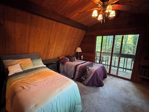 Relax in Nature in a gorgeous cozy cabin space that sleeps up to 8 people.