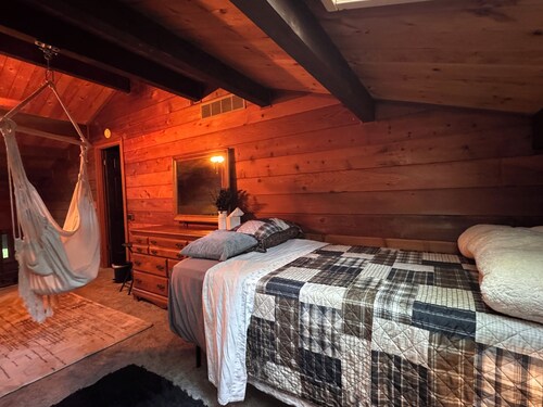 Relax in Nature in a gorgeous cozy cabin space that sleeps up to 8 people.