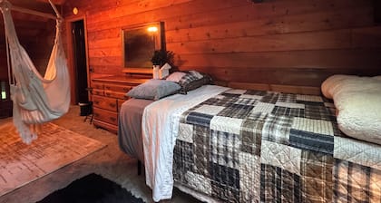 Relax in Nature in a gorgeous cozy cabin space that sleeps up to 8 people.