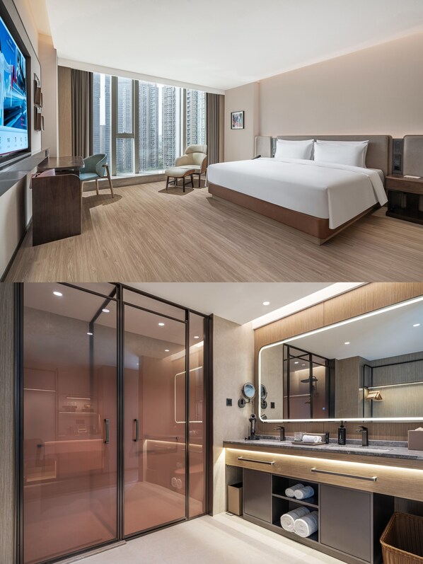 A hotel room with a large bed, a desk, a chair, and a television.