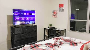 1 bedroom, desk, iron/ironing board, travel crib
