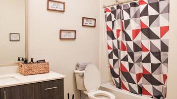 Shower, hair dryer, towels, shampoo