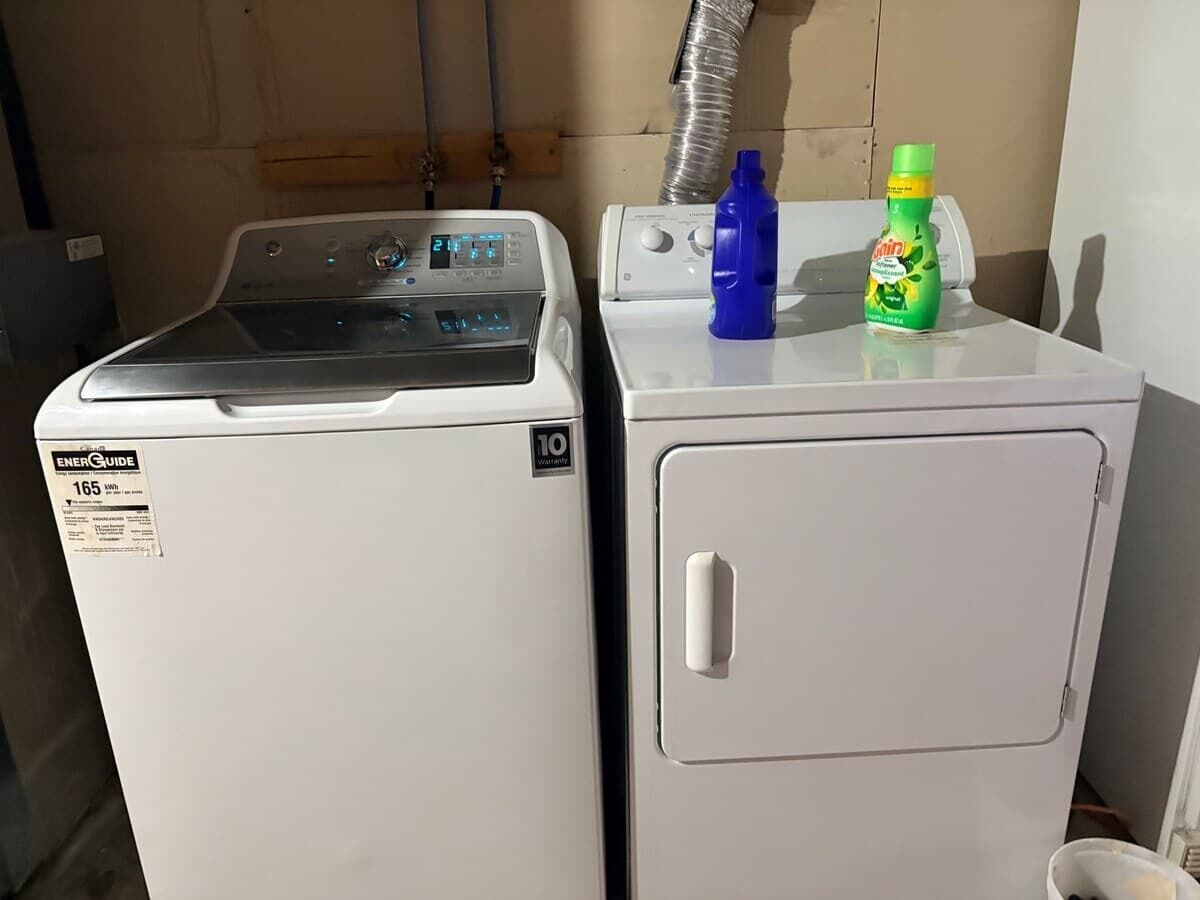 Two stacked appliances, one with a digital display and the other with a control panel.