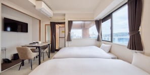 A hotel room with two beds, a desk, a chair, a television, and a window with curtains. - DIA PALACE OHTEMON (Kanazawa)