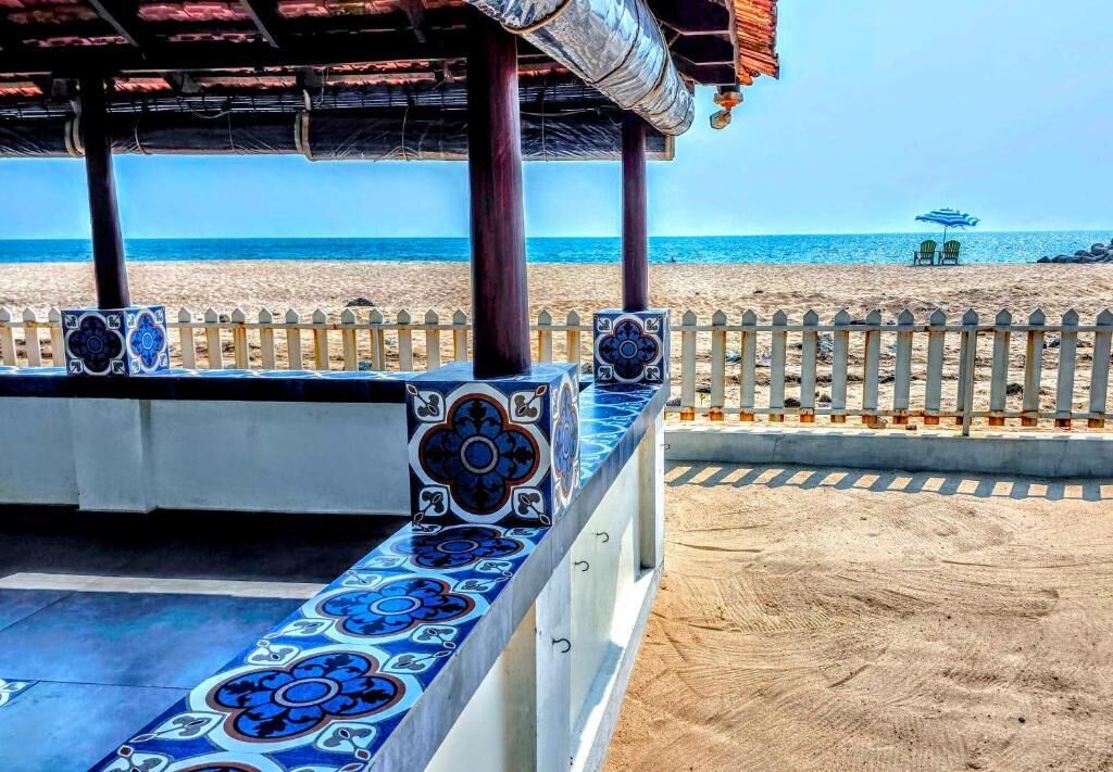 On the beach, white sand, beach umbrellas, beach towels