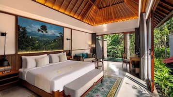 A spacious bedroom with a large bed, a nightstand, a bedside table, a wall-mounted lamp, and a painting of a landscape.