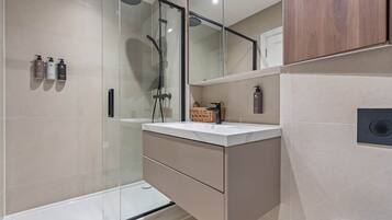 Shower, eco-friendly toiletries, hair dryer, towels