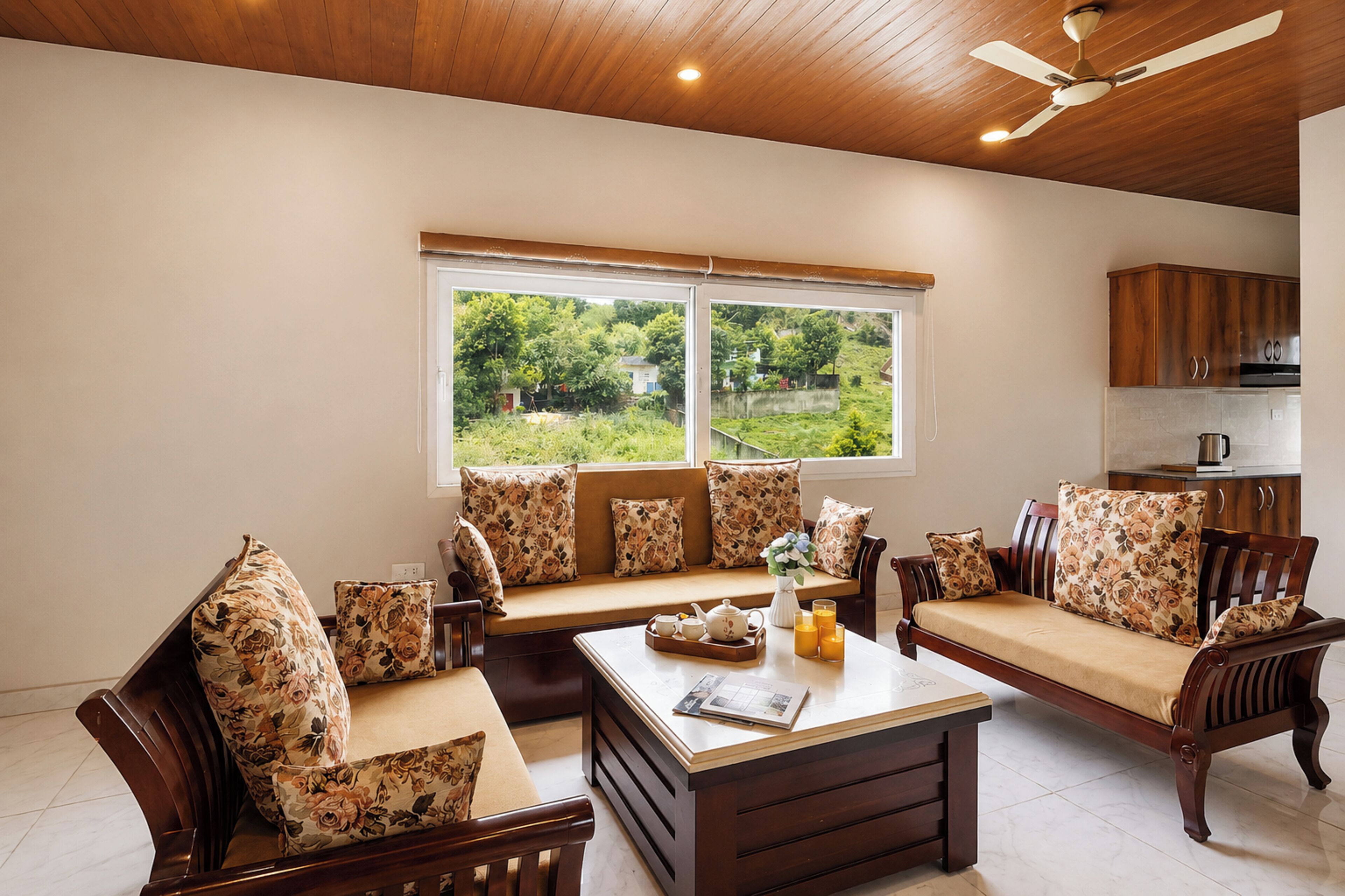 A living room with a sofa set, a coffee table, and a window with a view of greenery.