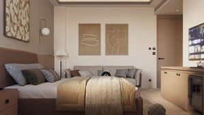 A modern bedroom with a bed, bedside tables, a lamp, artwork, and a television. - Ananta Elite (Somnath)