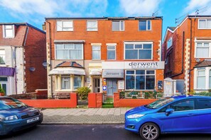 A two-story building with a sign for 'derwent blackpool' and a smaller sign for 'Lyndale holiday flats'. - Sleeps 30 Pool Table, Groups & Families stays (Blackpool)