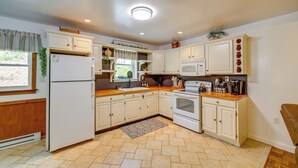 A kitchen with white cabinets, a refrigerator, an oven, and a microwave. - Swings, Fire Pit + Views: Shirleysburg Cabin! (Shirleysburg)