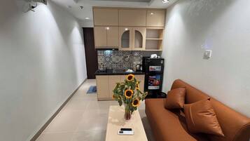 Quarto standard, vista para a cidade | Área de estar