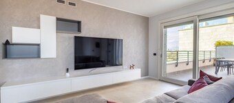 An elegant 198-square-meter apartment, perfect for six guests, located on the sixth floor of a modern building with an elevator (NOT accessible to people with disabilities).The property is situated in Treviglio, a town known for its lively historic cente