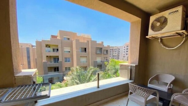 Outdoor dining - Chic 2BR Apartment with Private Garden | Prime Location by AUC (Cairo Governorate)