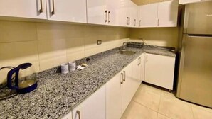 Private kitchen - Chic 2BR Apartment with Private Garden | Prime Location by AUC (Cairo Governorate)