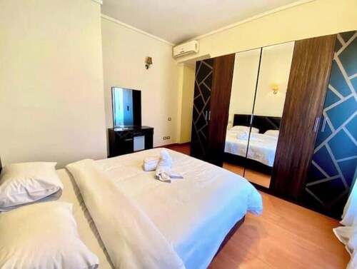Chic 2BR Apartment with Private Garden | Prime Location by AUC