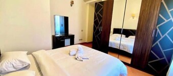 Chic 2BR Apartment with Private Garden | Prime Location by AUC