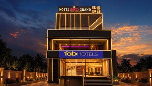 A hotel with a modern design, featuring a prominent sign for 'Hotel SBD Grand' and 'FabHotels' branding. - Fabhotel Ssd Grand (Visakhapatnam)