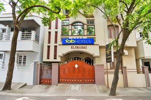 A hotel with a prominent sign for 'Tab Hotels' and 'Heavens Inn AC Room' on the facade. - FabHotel Heavens Inn (Chennai)
