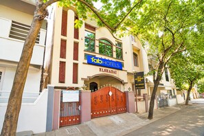 A hotel with a prominent sign for 'fabHOTELS' and 'ELSHADAI' written on the facade. - FabHotel Heavens Inn (Chennai)