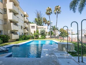 A swimming pool with a clear blue water surface, surrounded by a concrete deck. - La Sirena by Interhome (Torremolinos)