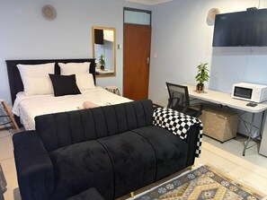 Appartamento Basic, vista giardino | Ferro/asse da stiro, Wi-Fi gratuito