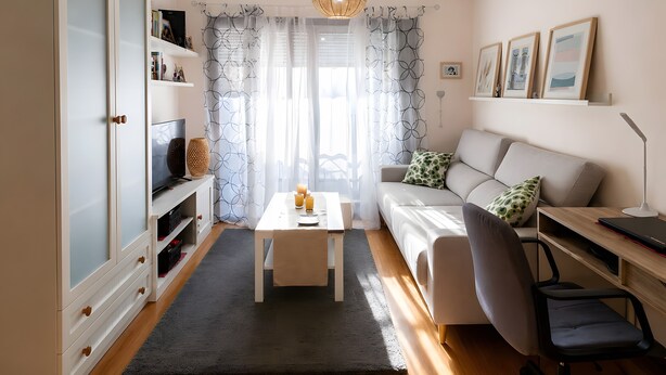 A modern living room with a sofa, a coffee table, a desk with a chair, and a bookshelf. - Apartment '2 Bedroom  On The Beach' with Sea View and Wi-Fi (Moaña)