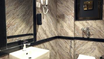 Business Suite, City View | Bathroom | Shower, designer toiletries, hair dryer, slippers