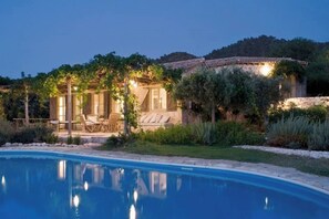 A villa with a swimming pool, outdoor seating, and a garden. - Aphrodite's Oasis with Private Pool (Pomos)