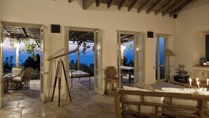 A room with a bed, a telescope, and a view of the outdoors. - Aphrodite's Oasis with Private Pool (Pomos)