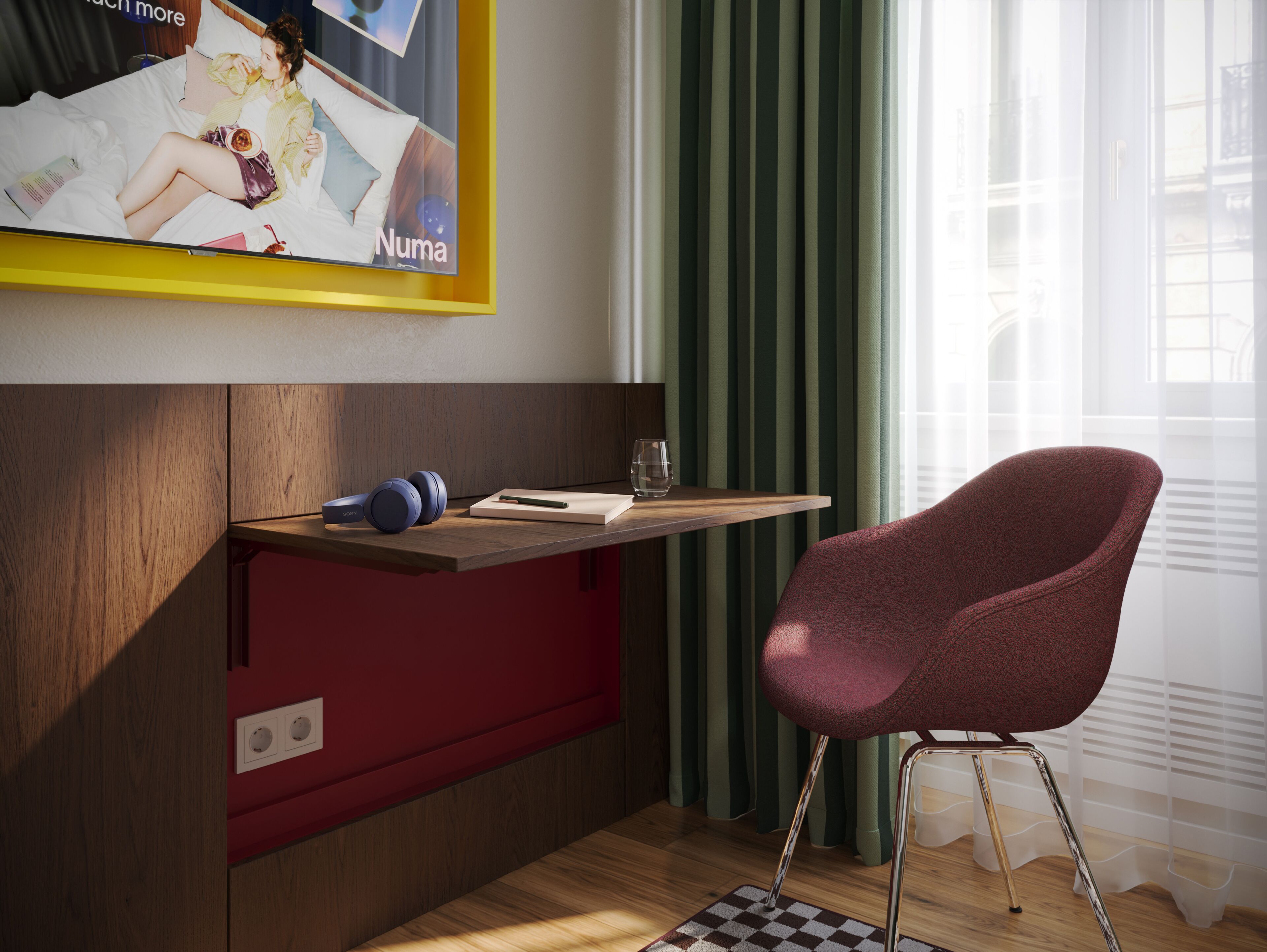 Una habitación moderna con un escritorio de madera, un armario rojo, una silla morada y un televisor fijado a la pared.