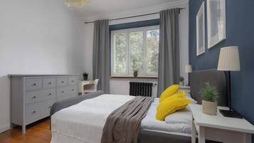 1 bedroom, desk, iron/ironing board, travel crib