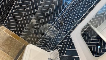 Shower, hair dryer, towels, toilet paper