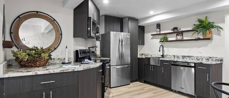 Coffee/tea maker, fridge, microwave, oven