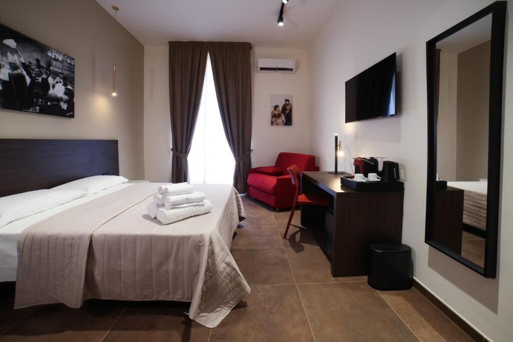 Deluxe Triple Room, Balcony, City View | In-room safe, blackout curtains, soundproofing