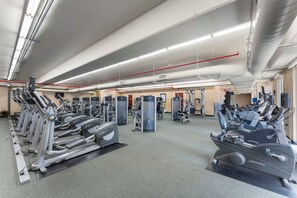 A gym with treadmills, weight machines, and exercise equipment. - Beachfront Bliss with Gulf Views and Resort Pools (Panama City Beach)