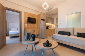 Family Suite, Balcony, Partial Sea View | Living area | 40-inch Smart TV with cable channels - SARTI PREMIUM LUXURY SUITES  (SITHONIA)